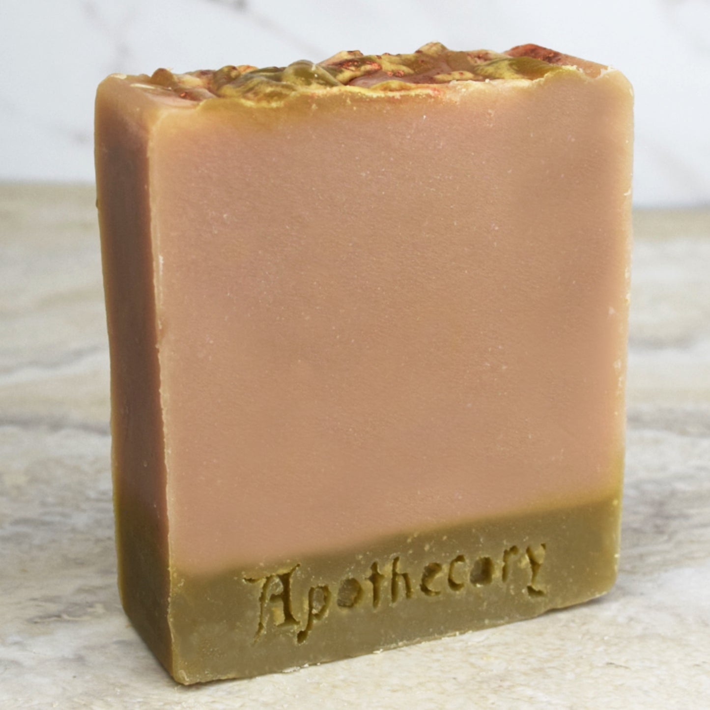 oak and leather scented beige soap with exfoliating sea clay