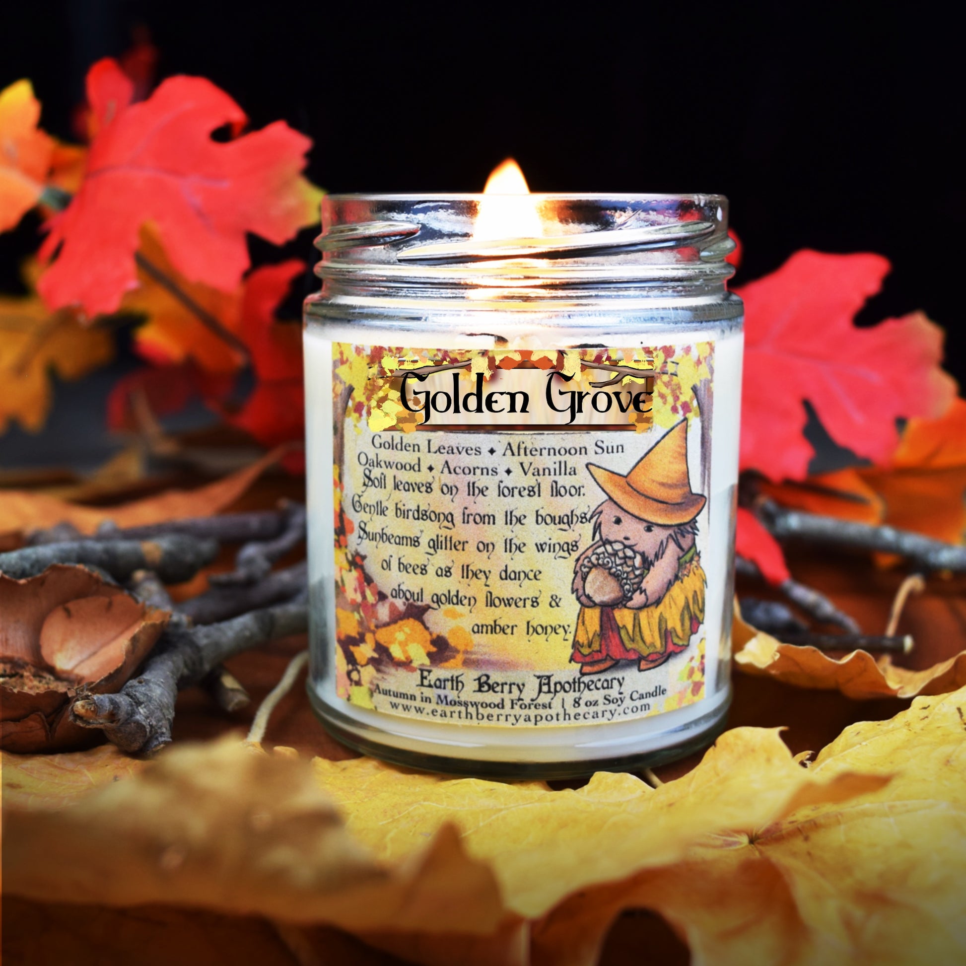 Vanilla honey scented candle for autumn. The label features a hedge witch holding an acorn and golden oak leaves around the border