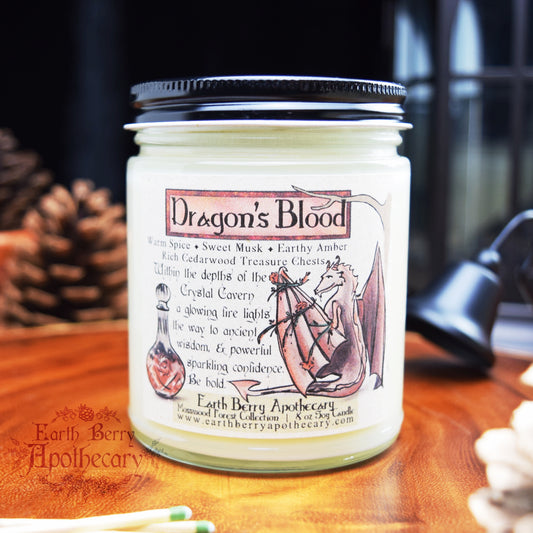 Dragons blood candle featuring a red dragon and potion bottle