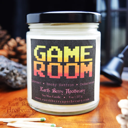 Game room leather smoke and cedar scented candle. In retro gamer “game over” style.