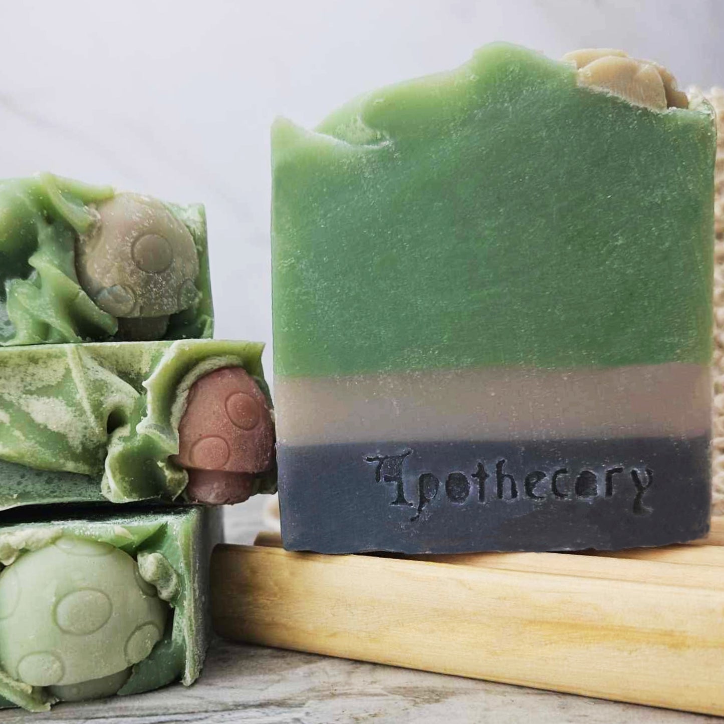 Patchouli Sandalwood bar soap. Green, black, and grey mushroom soap. Sea Clay and charcoal exfoliating soap.