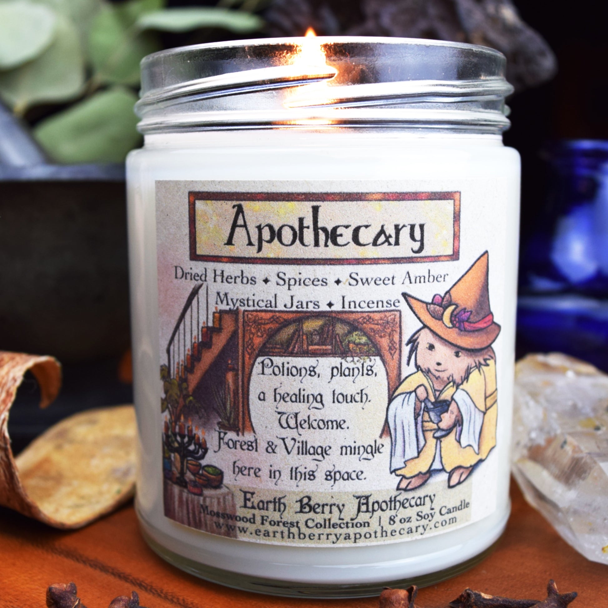 Apothecary candle scented with dried herbs, spices, sweet amber, mystical jars, and incense.